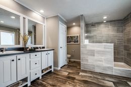 The 7030 HIGH ROCK 6028 Master Bathroom. This Manufactured Mobile Home features 3 bedrooms and 2 baths.