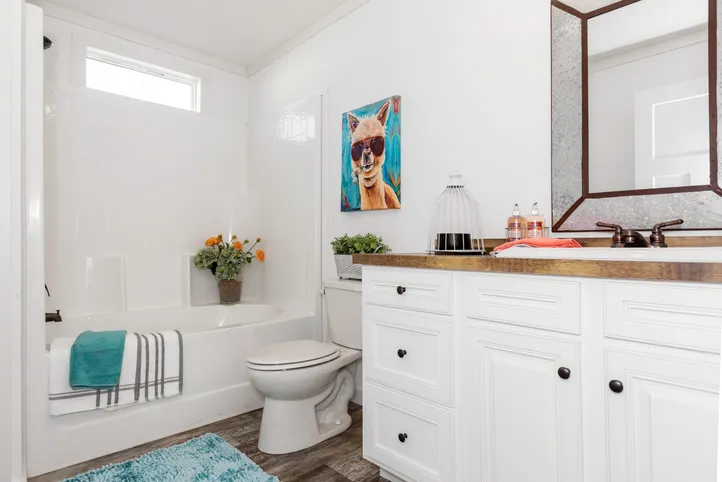 The THE LULABELLE Guest Bathroom. This Manufactured Mobile Home features 4 bedrooms and 3 baths.
