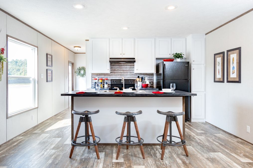 The MAYNARDVILLE CLASSIC 56 Dining Area. This Manufactured Mobile Home features 2 bedrooms and 2 baths.