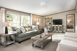 The TRIUMPH Living Room. This Manufactured Mobile Home features 5 bedrooms and 3 baths.