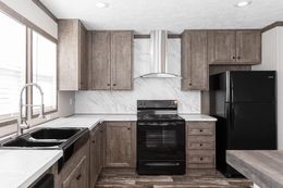 The THE SOCIAL 76 Kitchen. This Manufactured Mobile Home features 3 bedrooms and 2 baths.
