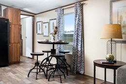 The VICTORY PLUS Dining Area. This Manufactured Mobile Home features 3 bedrooms and 2 baths.