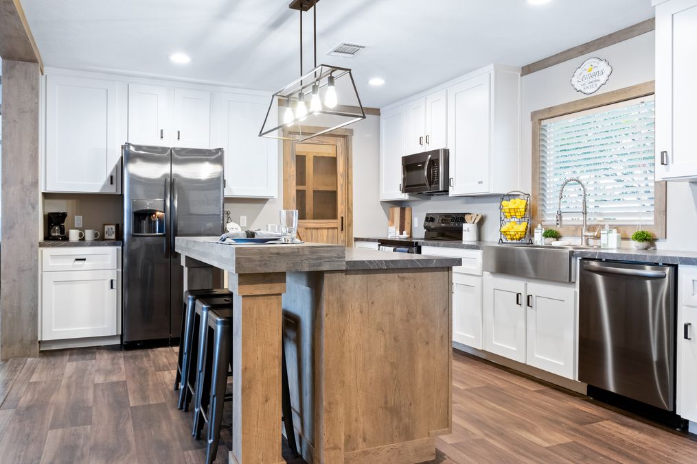 The FARMHOUSE 3 Kitchen. This Manufactured Mobile Home features 3 bedrooms and 2 baths.