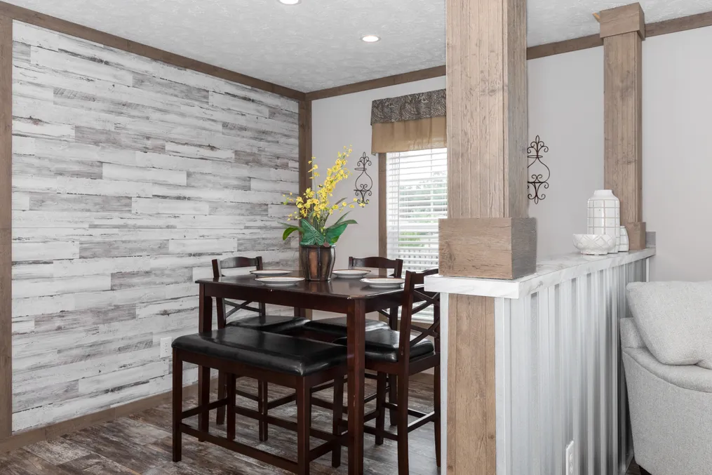 The THE WALSH Dining Area. This Manufactured Mobile Home features 3 bedrooms and 2 baths.