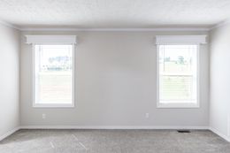 The REMINGTON Primary Bedroom. This Manufactured Mobile Home features 3 bedrooms and 2 baths.