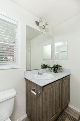 The FAIRPOINT 14602A Primary Bathroom. This Manufactured Mobile Home features 2 bedrooms and 2 baths.
