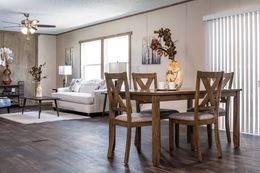 The ULTRA PRO BIG BOY Dining Area. This Manufactured Mobile Home features 4 bedrooms and 2 baths.