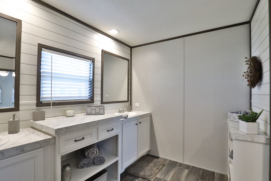 The BREEZE FARMHOUSE Primary Bathroom. This Manufactured Mobile Home features 3 bedrooms and 2 baths.