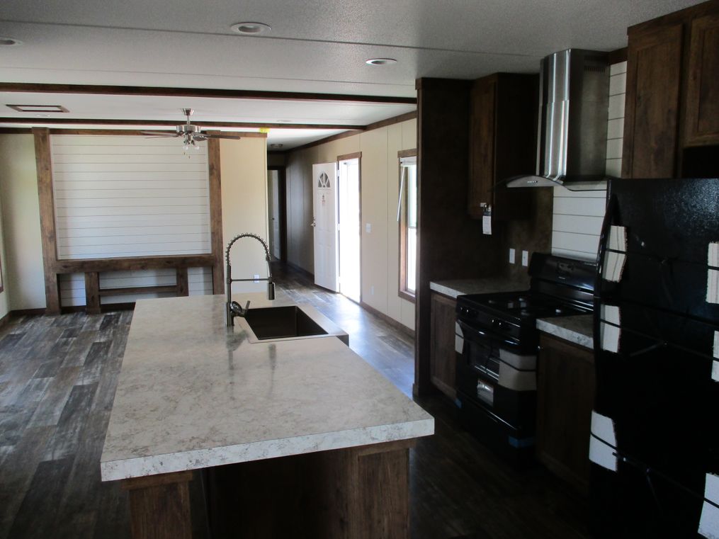 The THE ANNIVERSARY SPLASH Kitchen. This Manufactured Mobile Home features 3 bedrooms and 2 baths.