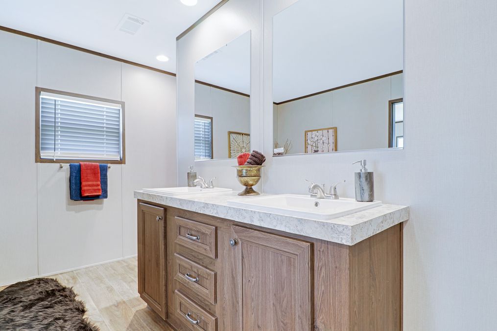 The THE ANNIVERSARY 2.1 Primary Bathroom. This Manufactured Mobile Home features 3 bedrooms and 2 baths.
