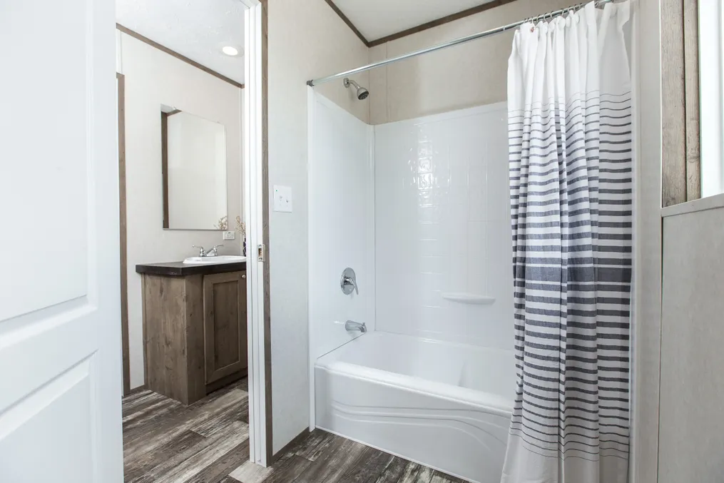 The THE BREEZE II Guest Bathroom. This Manufactured Mobile Home features 4 bedrooms and 2 baths.