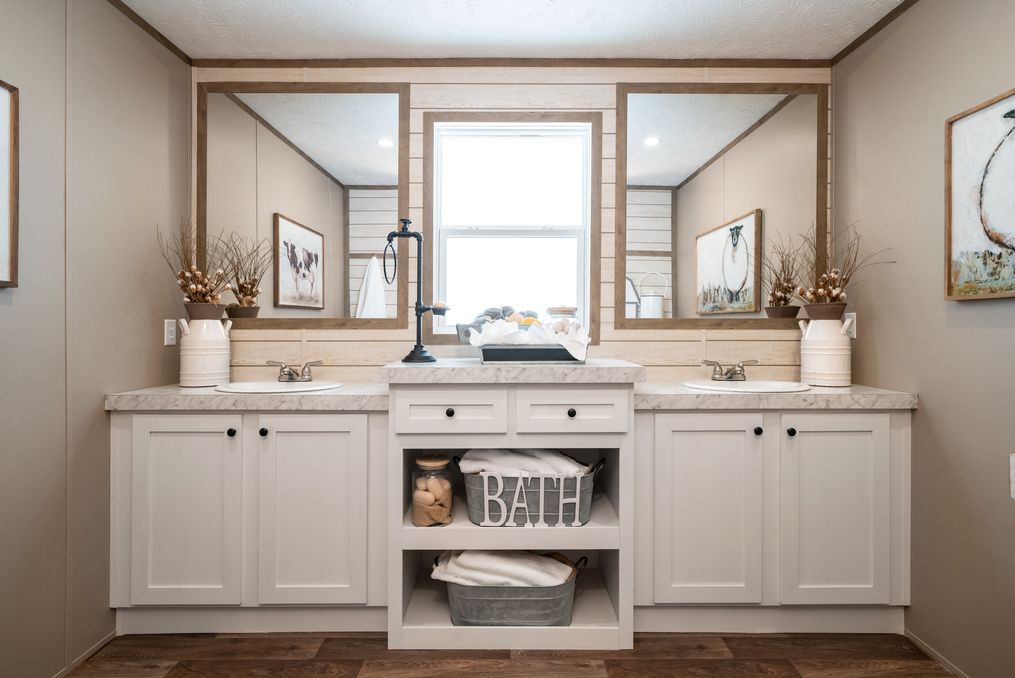 The FARMHOUSE BREEZE 72 Master Bathroom. This Manufactured Mobile Home features 4 bedrooms and 2 baths.