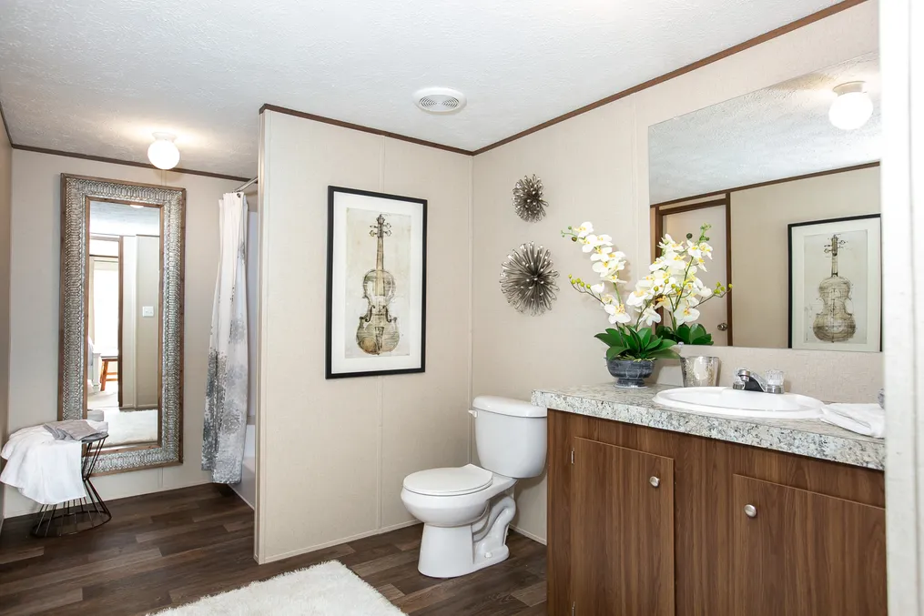 The TRIUMPH Primary Bathroom. This Manufactured Mobile Home features 5 bedrooms and 3 baths.