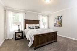 The KEENELAND Primary Bedroom. This Manufactured Mobile Home features 3 bedrooms and 2 baths.