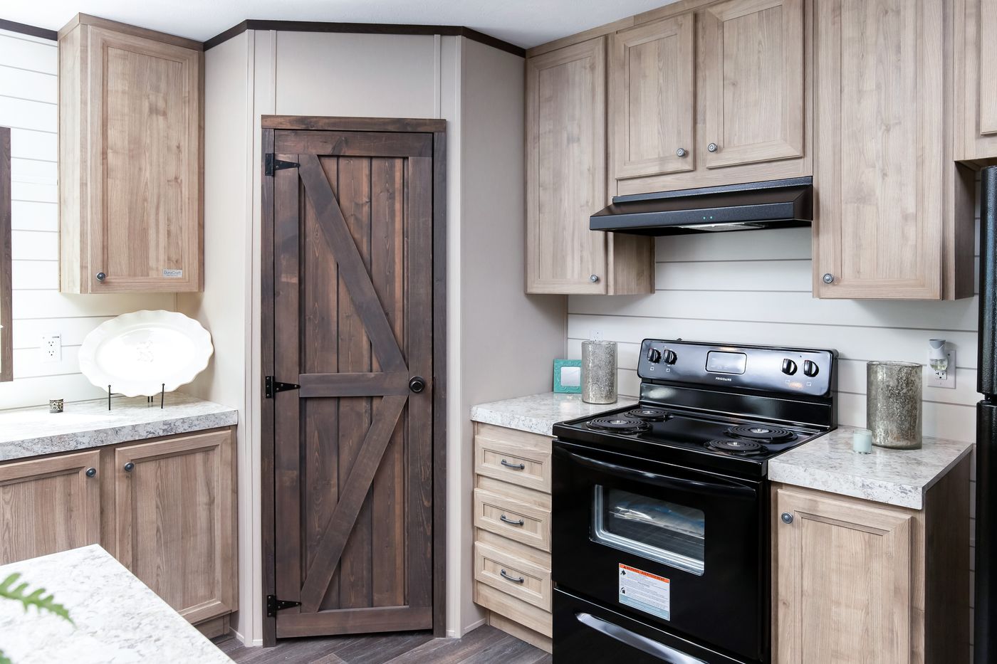The PT 78 LS Kitchen. This Manufactured Mobile Home features 3 bedrooms and 2 baths.