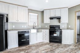 The ANNIVERSARY 16763F Kitchen. This Manufactured Mobile Home features 3 bedrooms and 2 baths.