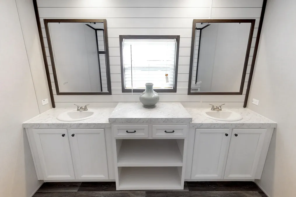 The BREEZE FARMHOUSE 72 Primary Bathroom. This Manufactured Mobile Home features 4 bedrooms and 2 baths.