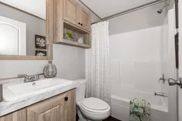 The THE 1959 Guest Bathroom. This Manufactured Mobile Home features 3 bedrooms and 2 baths.