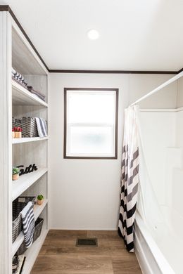 The THE HAMPTON BAY Guest Bathroom. This Manufactured Mobile Home features 3 bedrooms and 2 baths.