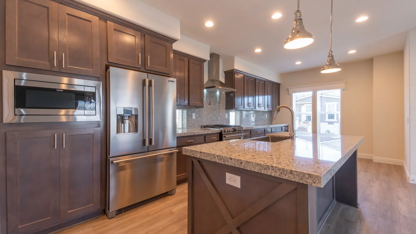 The CORONADO 2456B Kitchen. This Manufactured Mobile Home features 3 bedrooms and 2 baths.