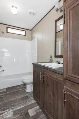 The THE RIVERWAY Guest Bathroom. This Manufactured Mobile Home features 4 bedrooms and 2 baths.