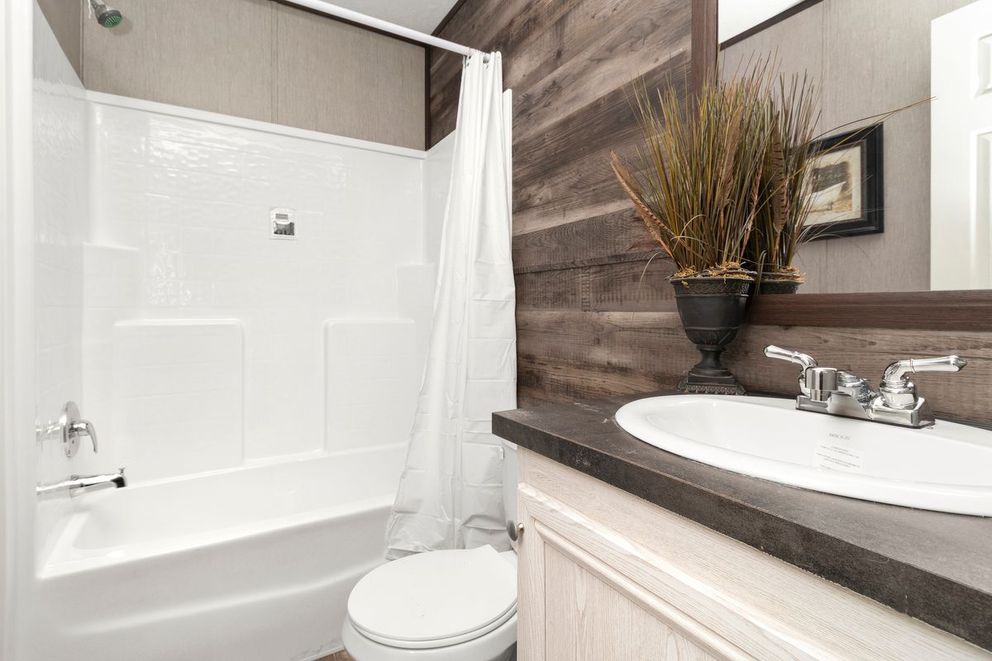 The THE SEASIDE Guest Bathroom. This Manufactured Mobile Home features 3 bedrooms and 2 baths.