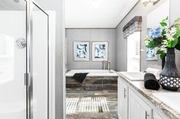The THE MORRIS Primary Bathroom. This Manufactured Mobile Home features 3 bedrooms and 2 baths.