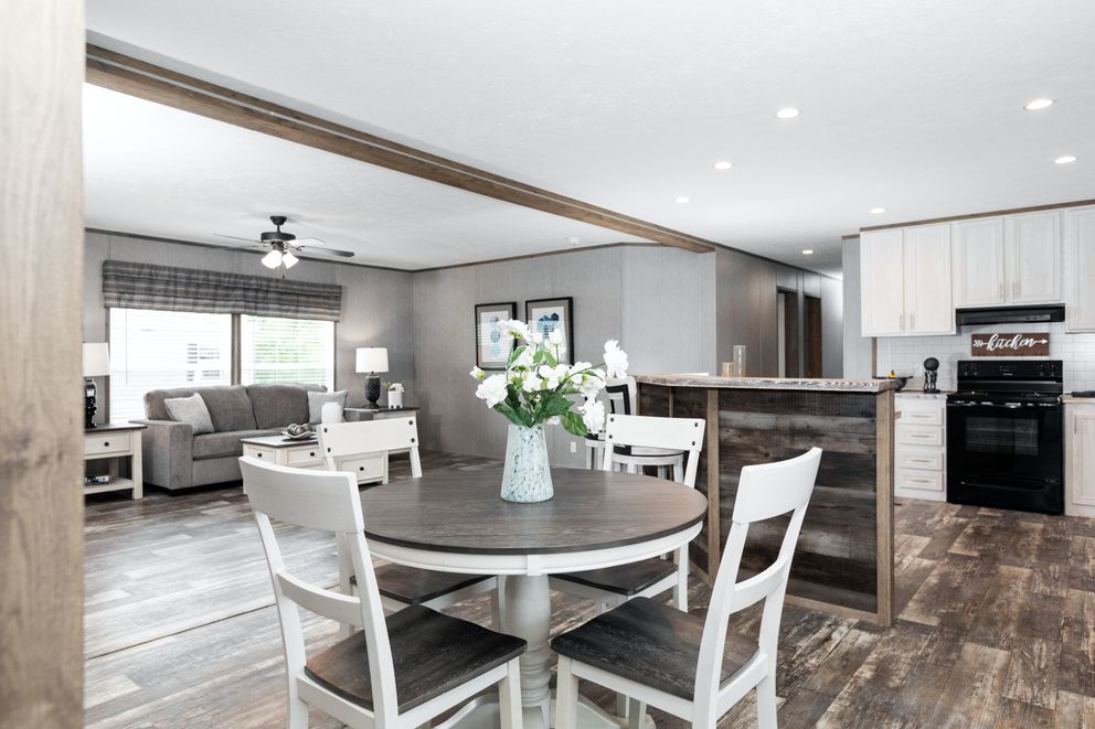 The THE MORRIS Dining Area. This Manufactured Mobile Home features 3 bedrooms and 2 baths.