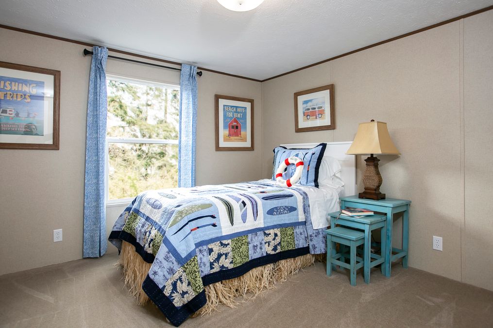 The TRIUMPH Guest Bedroom. This Manufactured Mobile Home features 5 bedrooms and 3 baths.