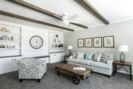 The COUNTRY AIRE Living Room. This Manufactured Mobile Home features 3 bedrooms and 3 baths.