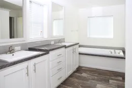 The EBONY Primary Bathroom. This Manufactured Mobile Home features 4 bedrooms and 2 baths.