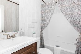 The THE ANNIVERSARY ISLANDER Guest Bathroom. This Manufactured Mobile Home features 3 bedrooms and 2 baths.