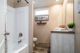 The ULTRO PRO HERCULES Guest Bathroom. This Manufactured Mobile Home features 3 bedrooms and 2 baths.