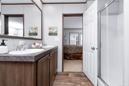 The CRAZY EIGHTS Primary Bathroom. This Manufactured Mobile Home features 4 bedrooms and 2 baths.