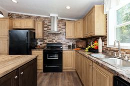 The SHEER ELM Kitchen. This Manufactured Mobile Home features 3 bedrooms and 2 baths.