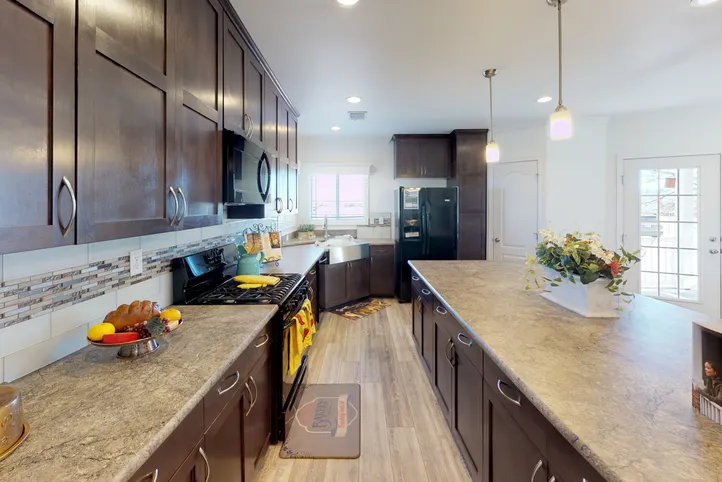 The SUM3068A Kitchen. This Manufactured Mobile Home features 3 bedrooms and 2 baths.