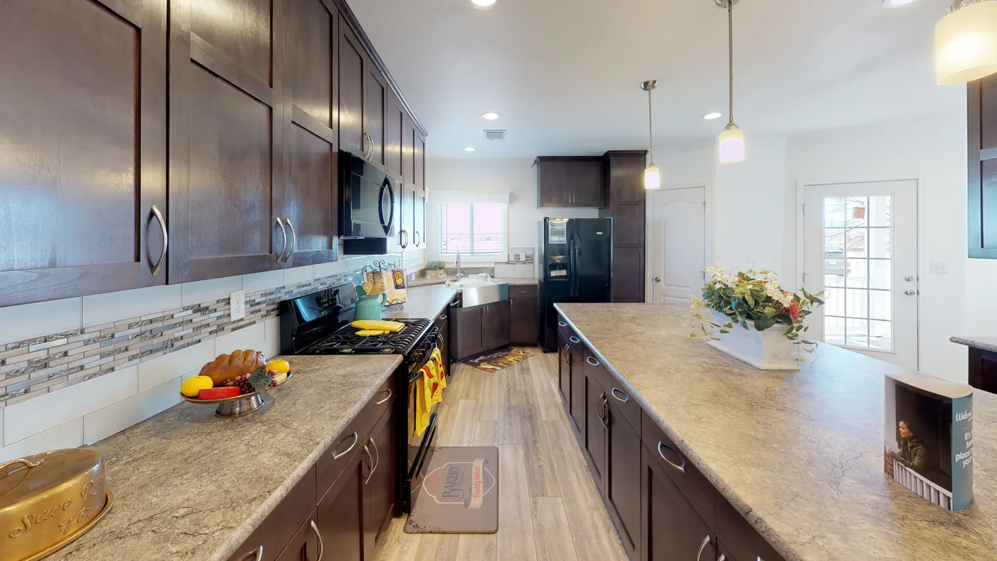 The SUM3068A Kitchen. This Manufactured Mobile Home features 3 bedrooms and 2 baths.