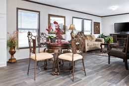 The THE CHOICE Dining Area. This Manufactured Mobile Home features 4 bedrooms and 2 baths.