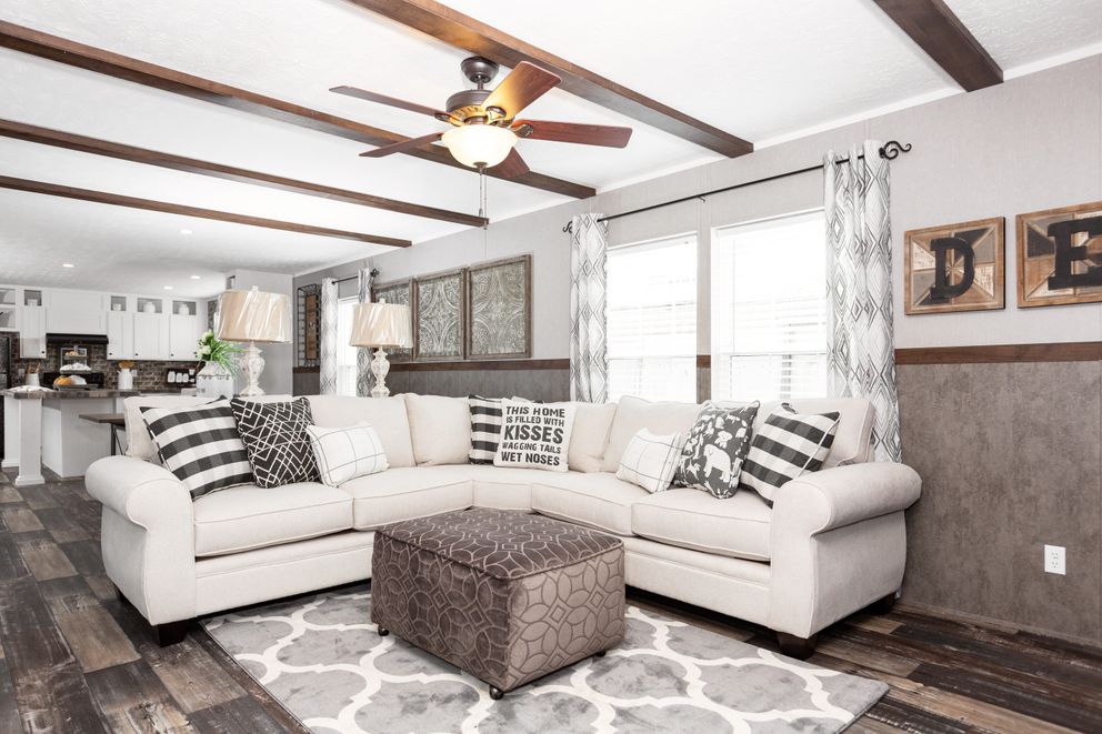 The TRADITION 76C Living Room. This Manufactured Mobile Home features 4 bedrooms and 2 baths.