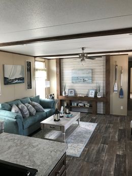 The THE ANNIVERSARY SPLASH Living Room. This Manufactured Mobile Home features 3 bedrooms and 2 baths.