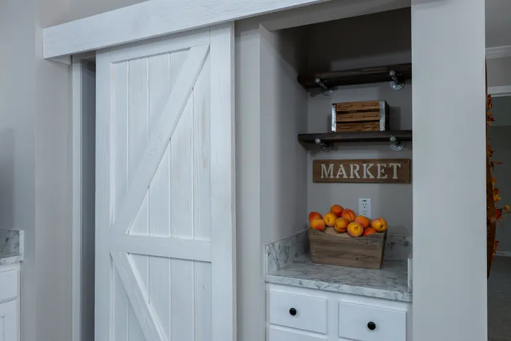 The THE FREEDOM BREEZE Kitchen. This Manufactured Mobile Home features 3 bedrooms and 2 baths.