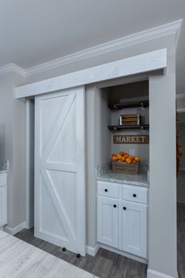 The THE FREEDOM BREEZE Kitchen. This Manufactured Mobile Home features 3 bedrooms and 2 baths.
