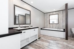 The KING AIR Primary Bathroom. This Manufactured Mobile Home features 4 bedrooms and 2 baths.