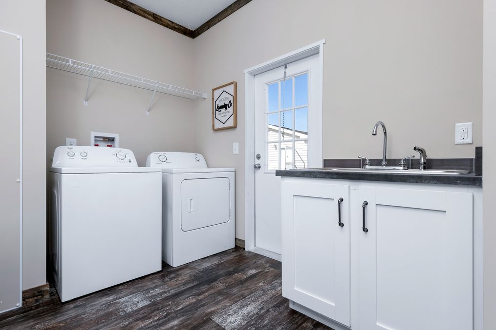 The THE MCGARRITY Utility Room. This Manufactured Mobile Home features 4 bedrooms and 2 baths.