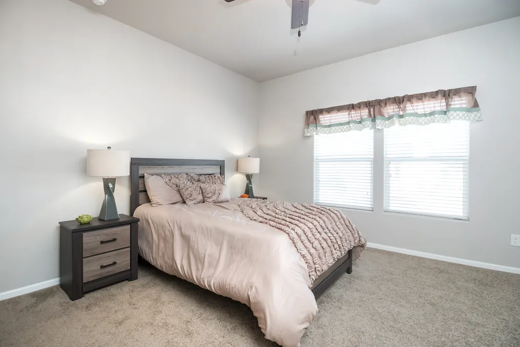 The ARTESIA Primary Bedroom. This Manufactured Mobile Home features 3 bedrooms and 2 baths.
