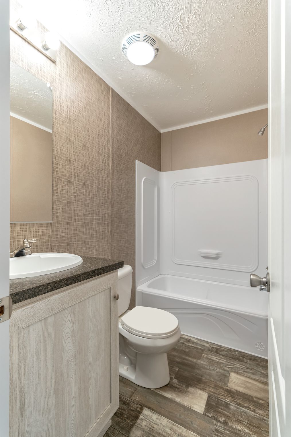 The THE ANNIVERSARY PLUS Guest Bathroom. This Manufactured Mobile Home features 3 bedrooms and 2 baths.