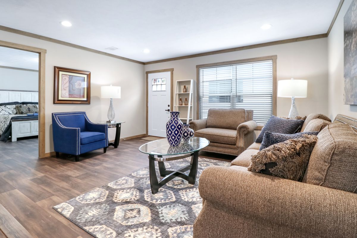 The AMELIA Living Room. This Manufactured Mobile Home features 4 bedrooms and 2 baths.
