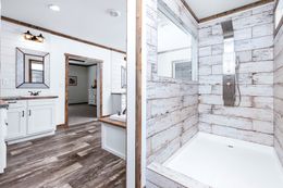The THE BRAZOS Primary Bathroom. This Manufactured Mobile Home features 3 bedrooms and 2.5 baths.