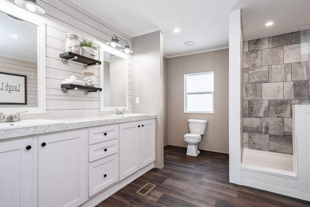 The THE RESERVE 60 Primary Bathroom. This Manufactured Mobile Home features 3 bedrooms and 2 baths.