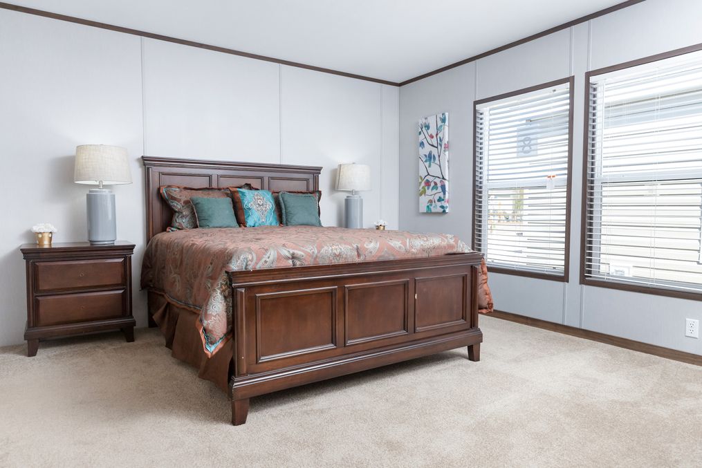 The CRAZY EIGHTS Primary Bedroom. This Manufactured Mobile Home features 4 bedrooms and 2 baths.